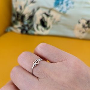 14 K white gold, 2mm (tapering down to .5mm) band ring, size 6, never worn.